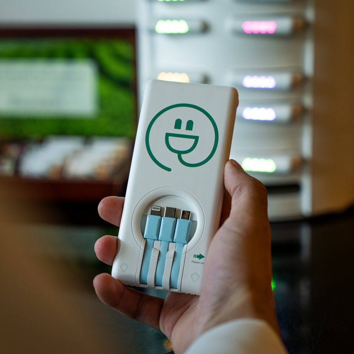 Esh7anly power bank with charging kiosk in background, Kuwait
