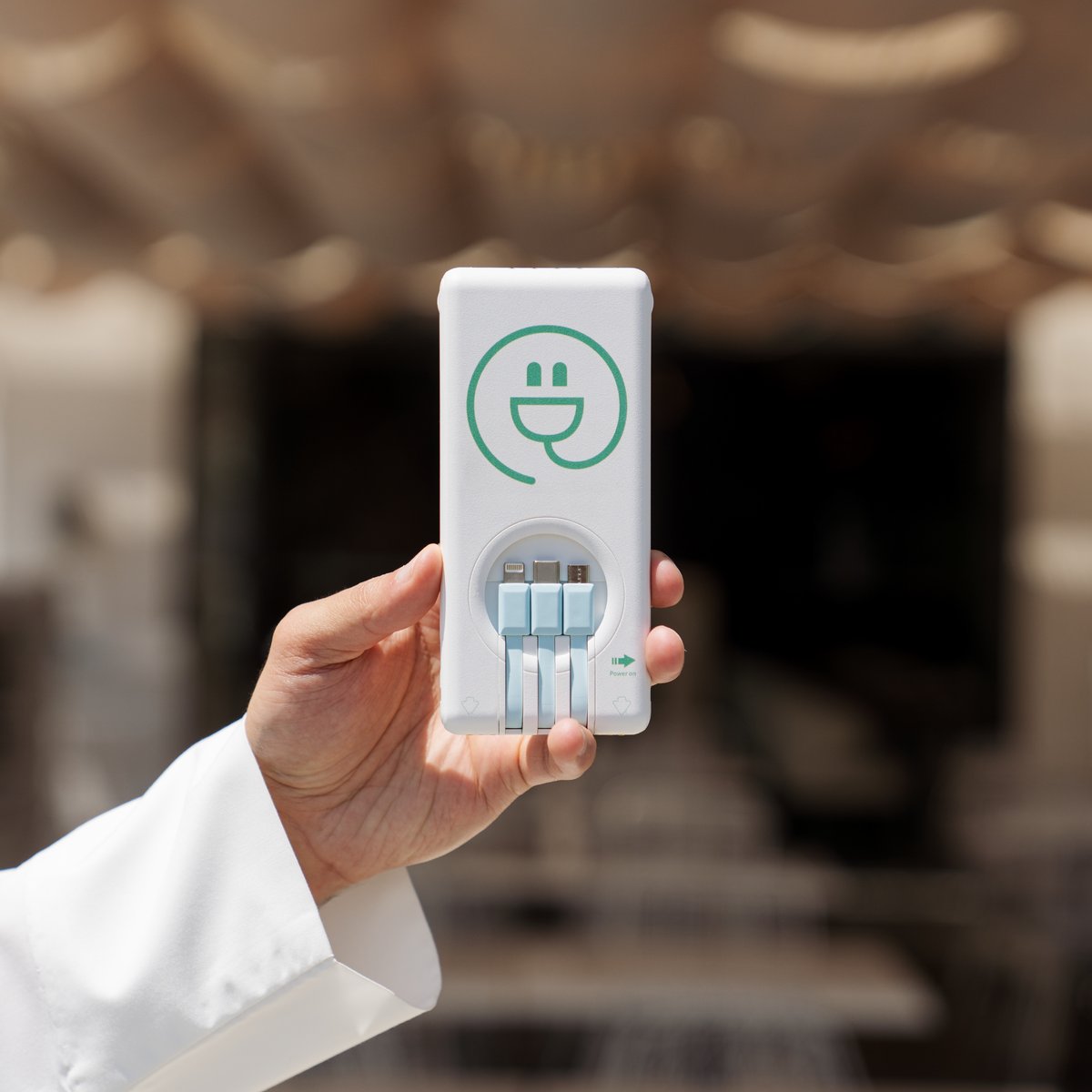 Esh7anly power bank held outdoors, Kuwait